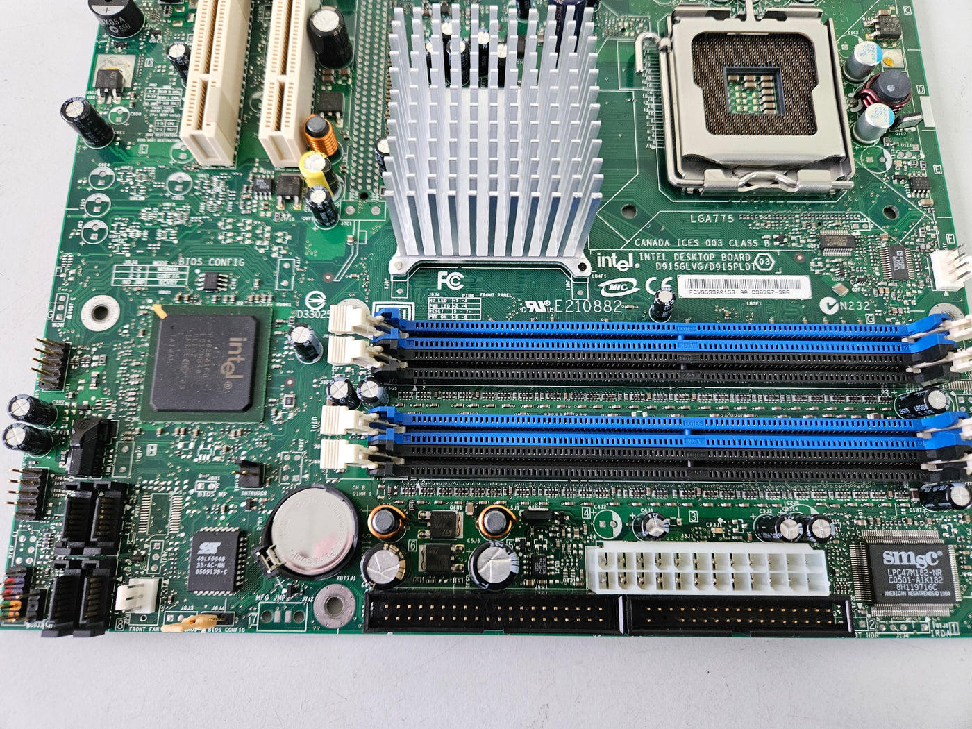 Intel E210882 Socket T LGA775 Desktop Motherboard ( C96367-306 D915GLVG ) USED