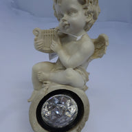 BS122163 - Premier cherub with solar white light. Harp Design - USED