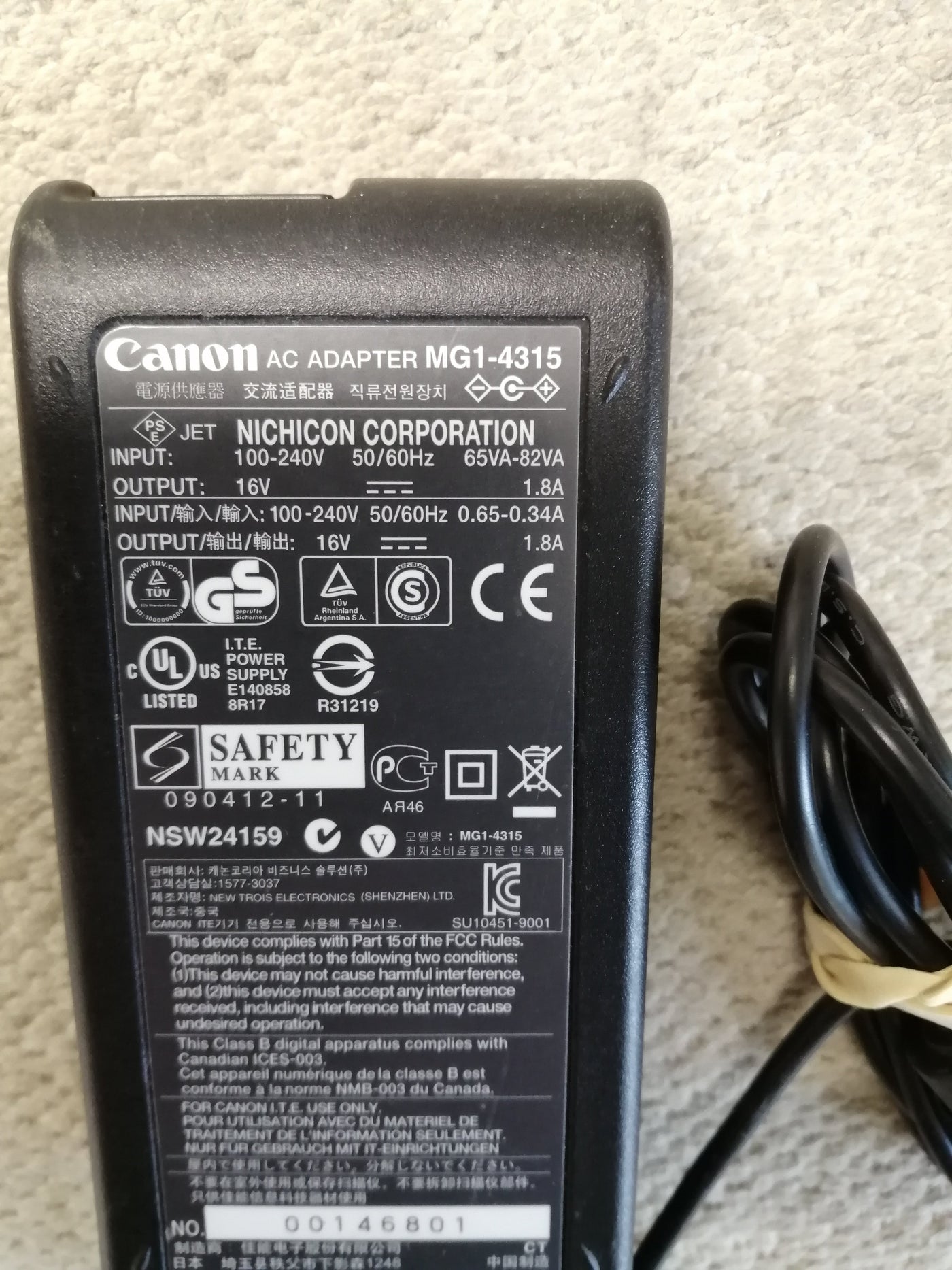 CANON AC ADAPTER IN 240V 65VA-82VA OUT 16V 1.8A ( MG1-4315 USED )